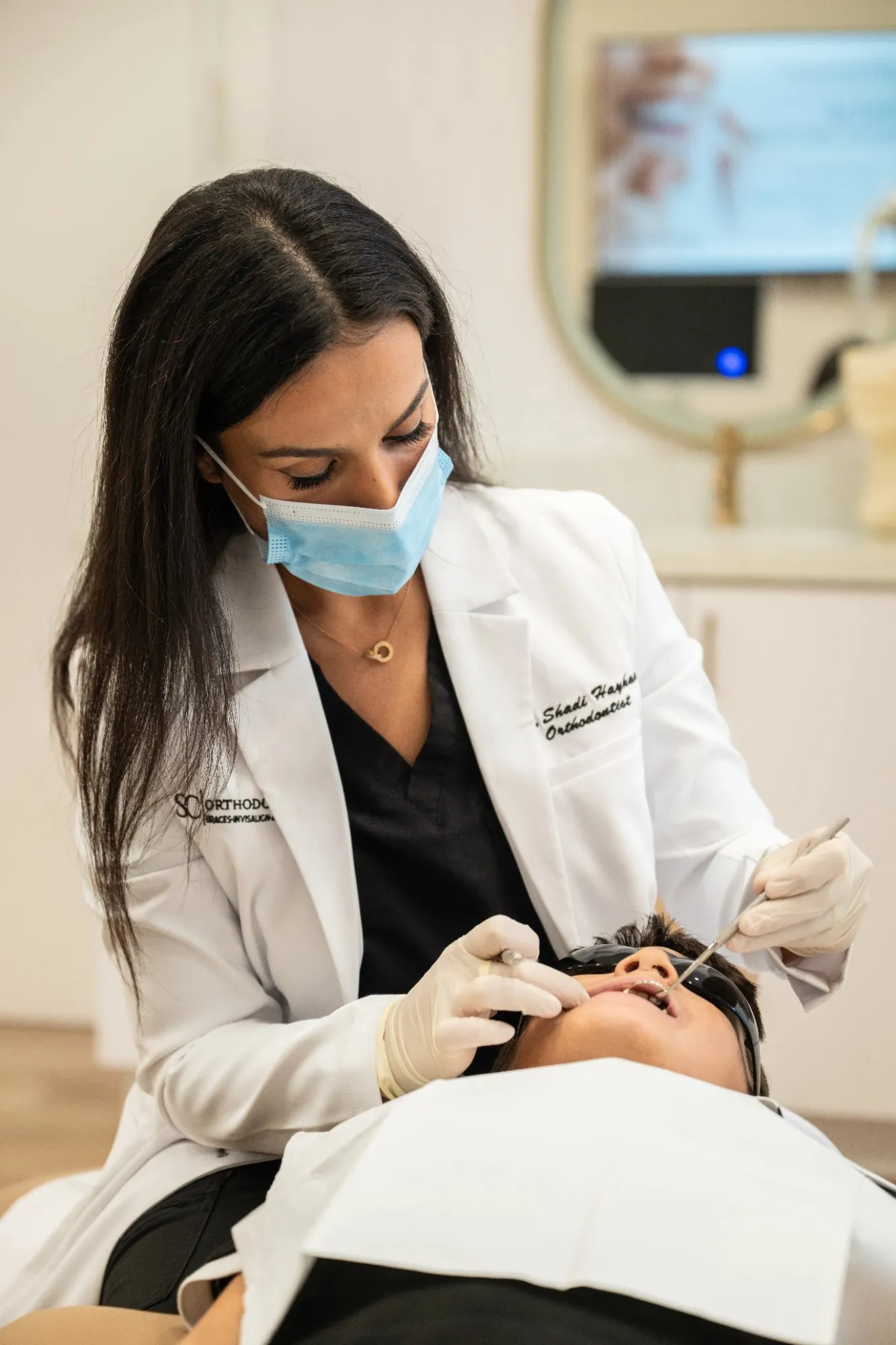 Dr. Haykani examining a young patient at SC Orthodontics