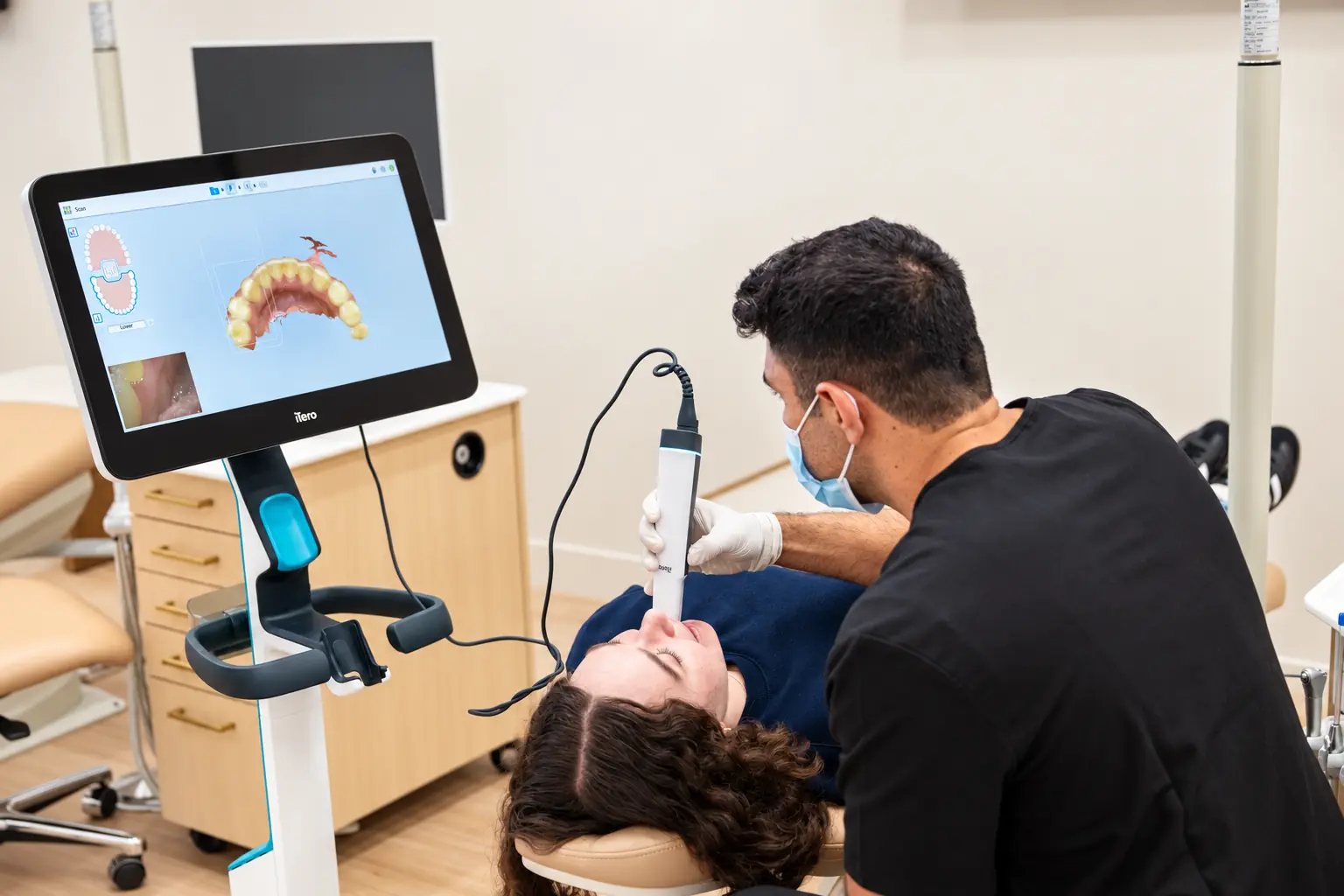 A patient receiving an iTero digital scan at SC Orthodontics